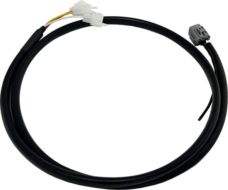 Reverse Light Kits by Baja Designs: A coiled black upfitter wiring harness with a white connector on one end and a gray connector on the other, on white.