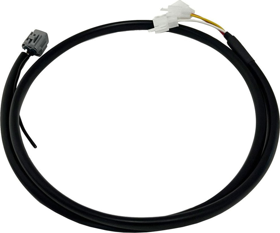 Reverse Light Kits by Baja Designs: A coiled black upfitter wiring harness with a white connector on one end and a gray connector on the other, on white.