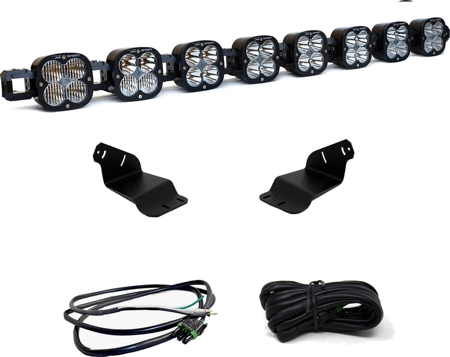 Roof Light Kits by Baja Designs: An eight-pod linkable LED roof bar with two black mounting brackets and two coiled wiring harnesses on white.