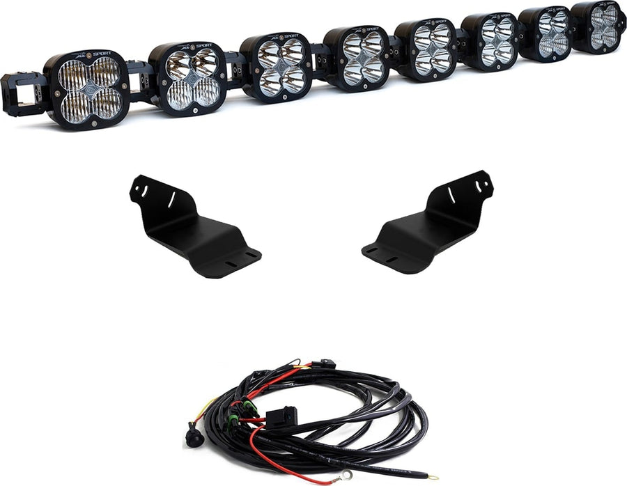 Roof Light Kits by Baja Designs: A linkable LED pod roof bar, two black mounting brackets and a wiring harness shown on a white background.