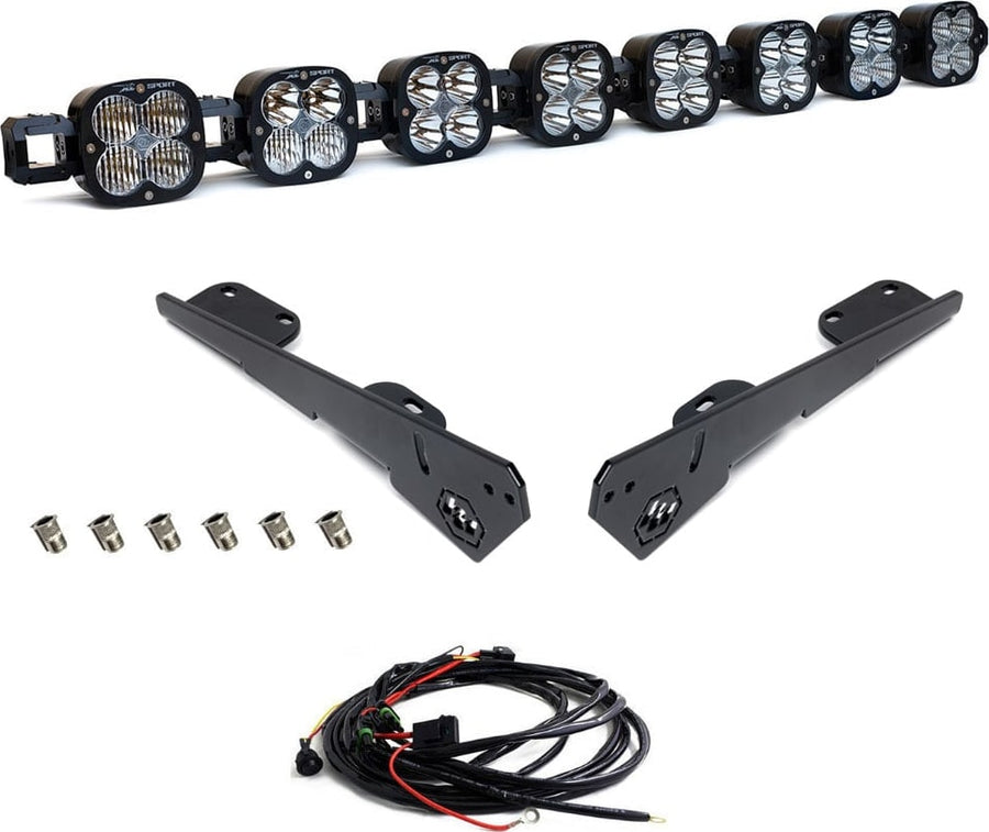 Roof Light Kits by Baja Designs: An eight-pod linkable LED roof bar with two black side brackets, nut inserts and a wiring harness on white.