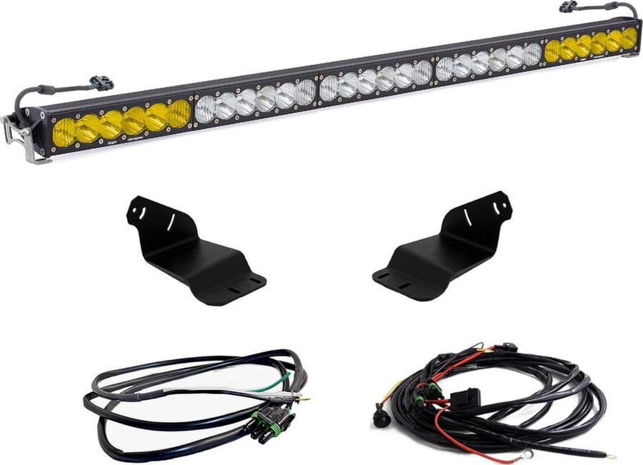 Roof Light Kits by Baja Designs: OnX6+ 50 inch light bar with amber ends and clear center, two roof brackets and two wiring harnesses on white.