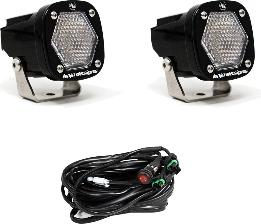 S1 Light Pods by Baja Designs: Pair of black S1 pods, clear work/scene dimpled lenses, with switch harness on a white background.