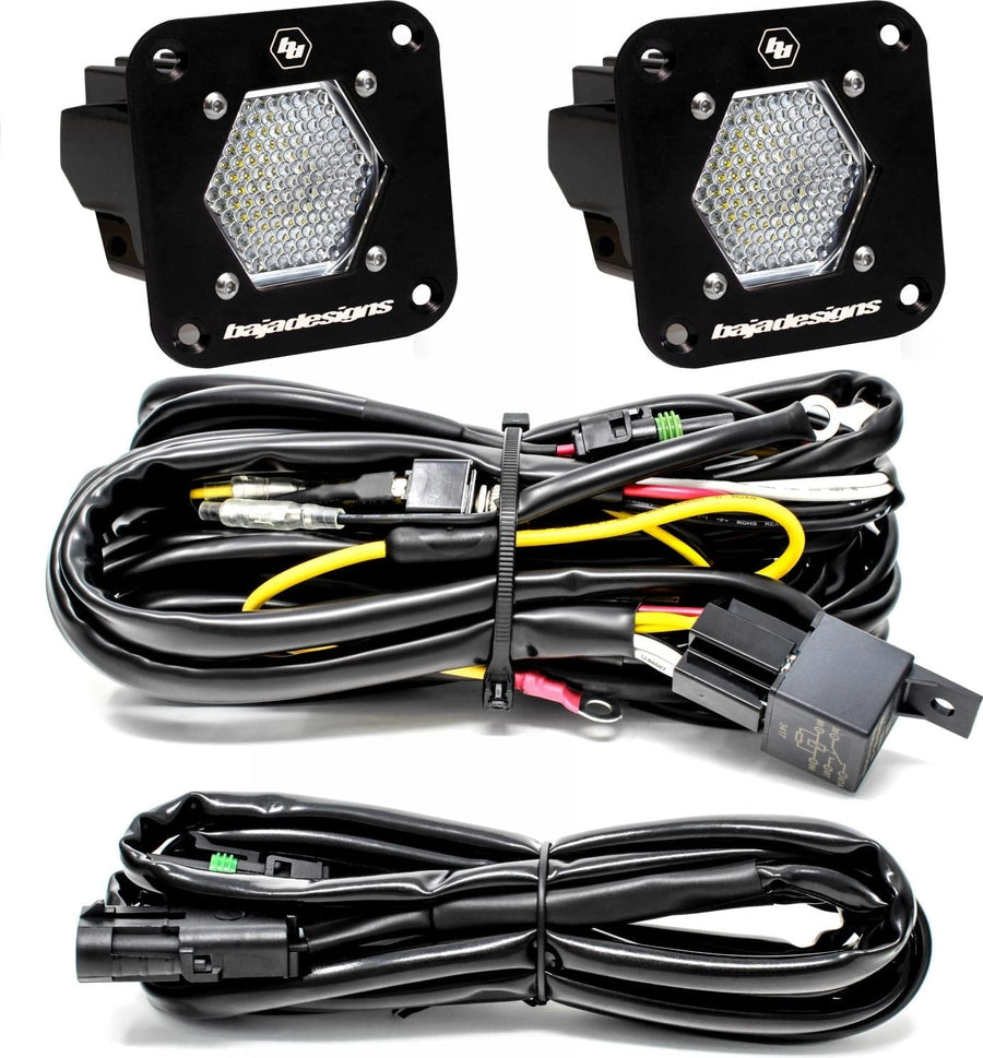 Mounts & Hardware by Baja Designs: Two black S1 flush mount pods, clear work/scene lenses, with relay harness and extension harness on a white background.