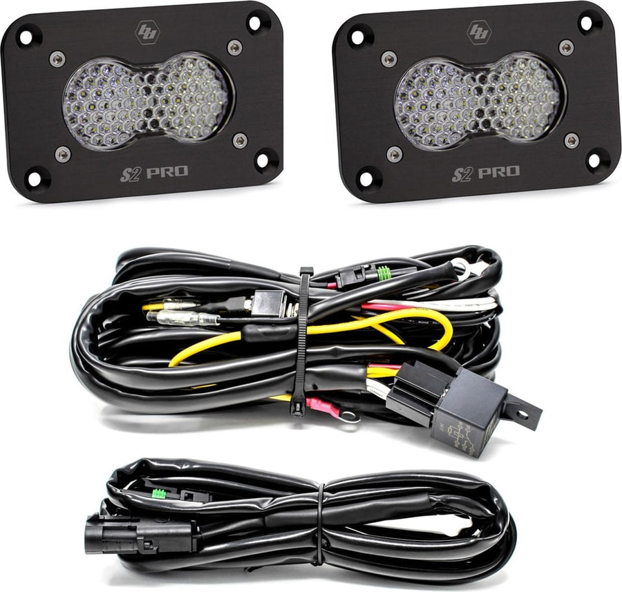 Mounts & Hardware by Baja Designs: Two black S2 Pro flush mount LED pods with clear honeycomb lenses, a relay wiring harness and an extension harness on a white background.