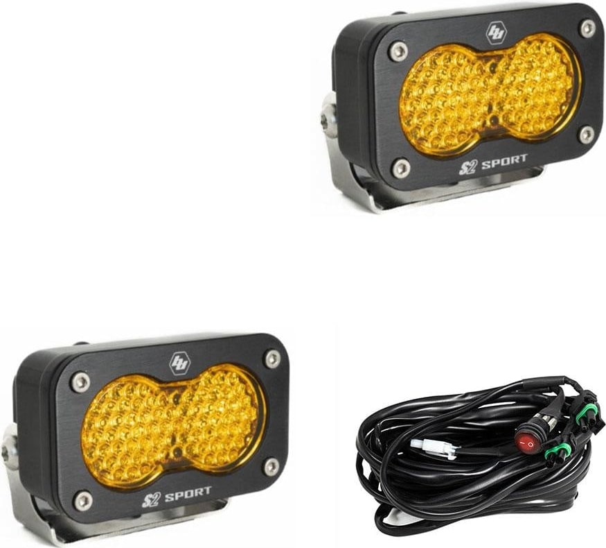 S2 Light Pods by Baja Designs: Pair of black S2 Sport light pods with amber dimpled work scene lenses and a wiring harness on a white background.