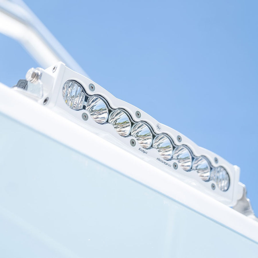 LED Light Bars by Baja Designs: White housing S8 LED light bar mounted on the edge of a white boat top against a blue sky.