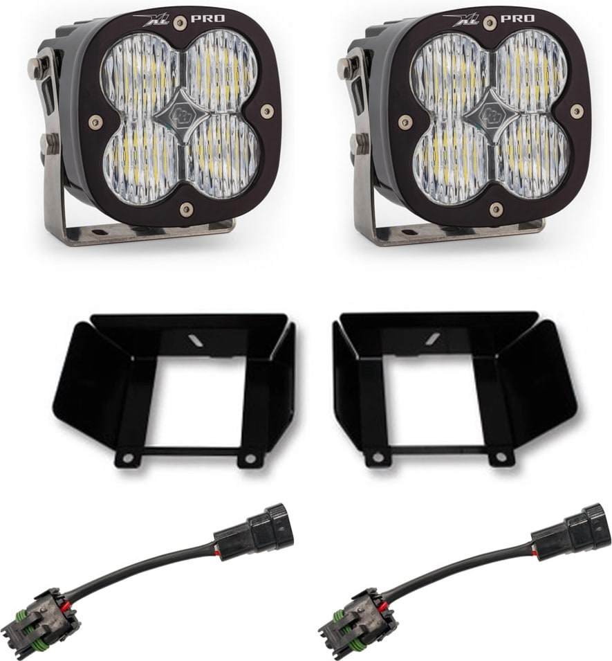 Fog Light Kits by Baja Designs: Two XL Pro LED pods with clear lenses, two black fog pocket brackets and two adapter harnesses on a white background.