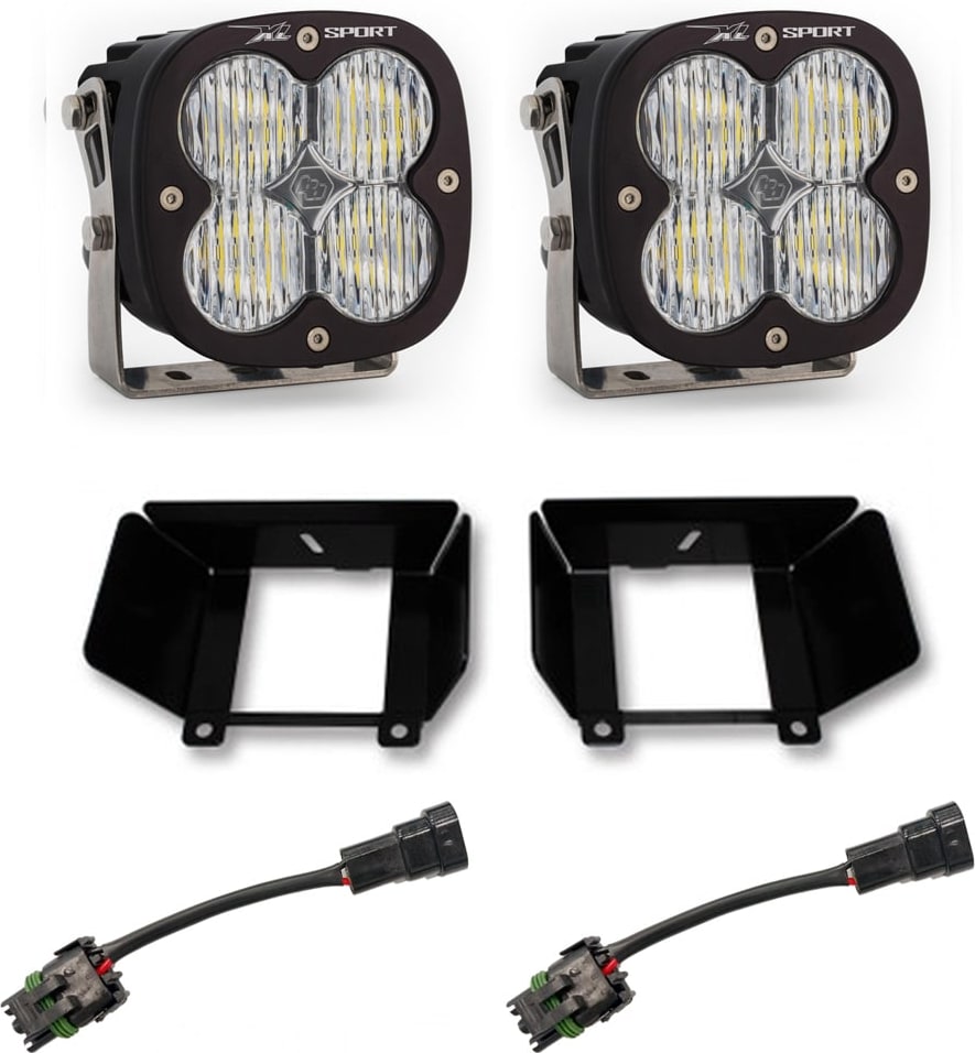 Fog Light Kits by Baja Designs: Two XL Sport LED pods with clear lenses, two black fog pocket brackets and two adapter harnesses on a white background.