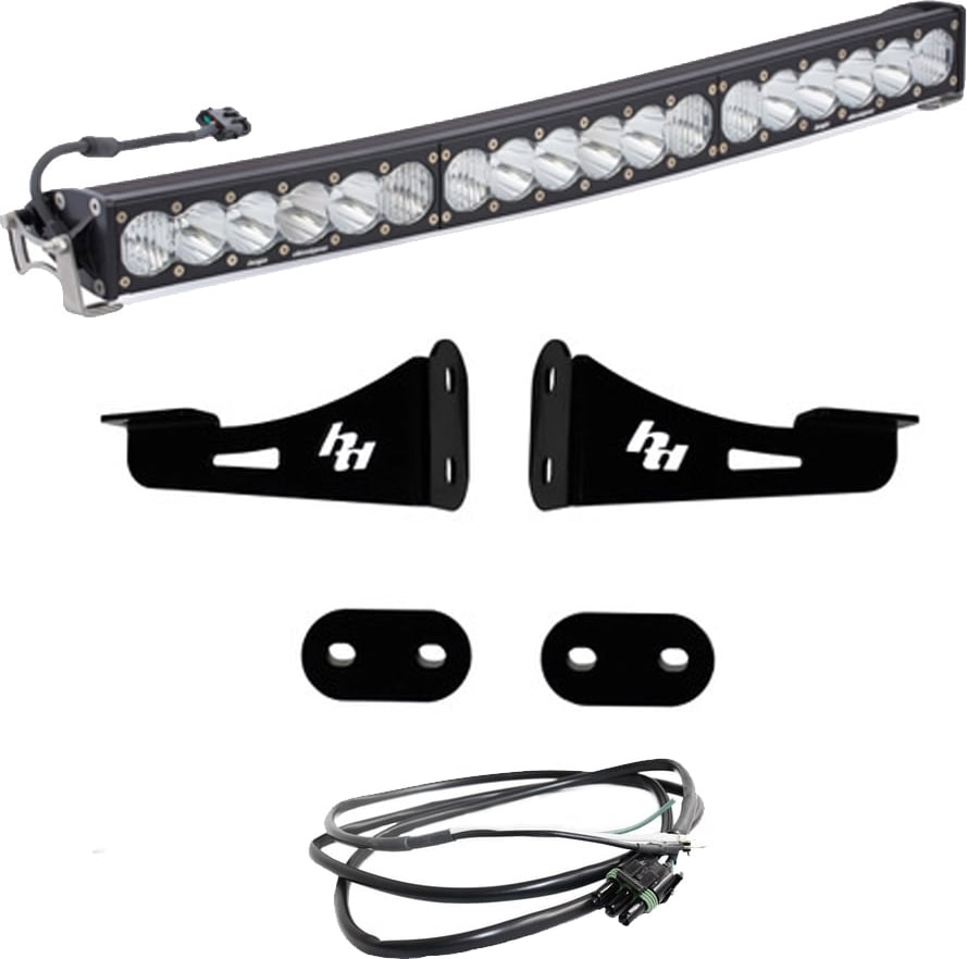 Bumper Light Kits by Baja Designs: A curved OnX6+ Arc LED light bar with two black mounting brackets, spacer plates and a wiring harness on a white background.