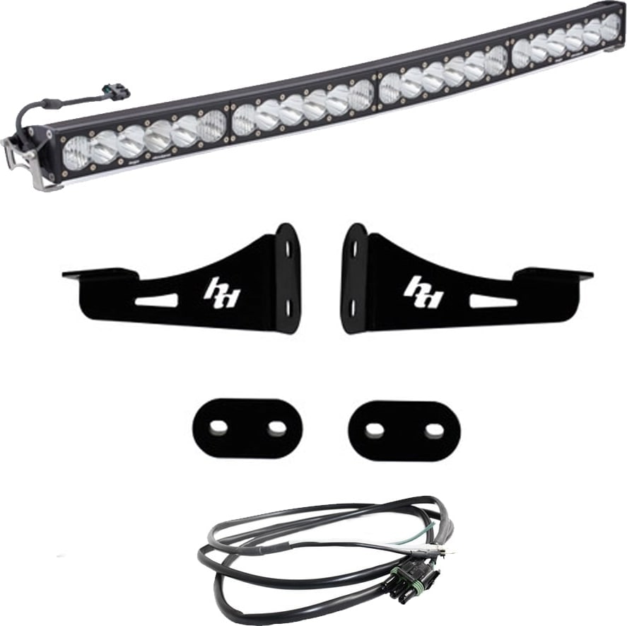 Bumper Light Kits by Baja Designs: A curved OnX6+ Arc LED light bar with two black mounting brackets, spacer plates and a wiring harness on a white background.