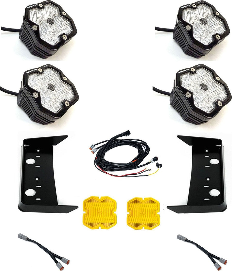 Grille Light Kits by Baja Designs: Four black Squadron Pro pods with clear lenses laid out with two black vent brackets, a harness, two splitters and two amber covers on white.