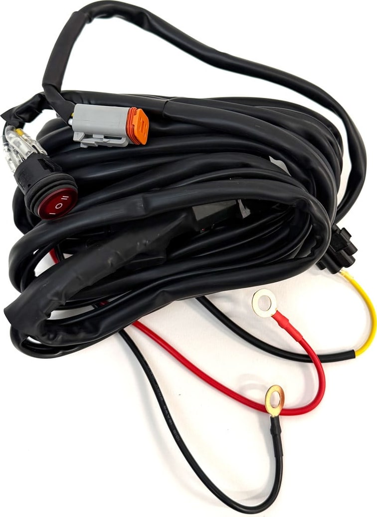 Wiring Harnesses by Baja Designs: A coiled single light harness with a Deutsch connector, switch and red and black power leads on white.