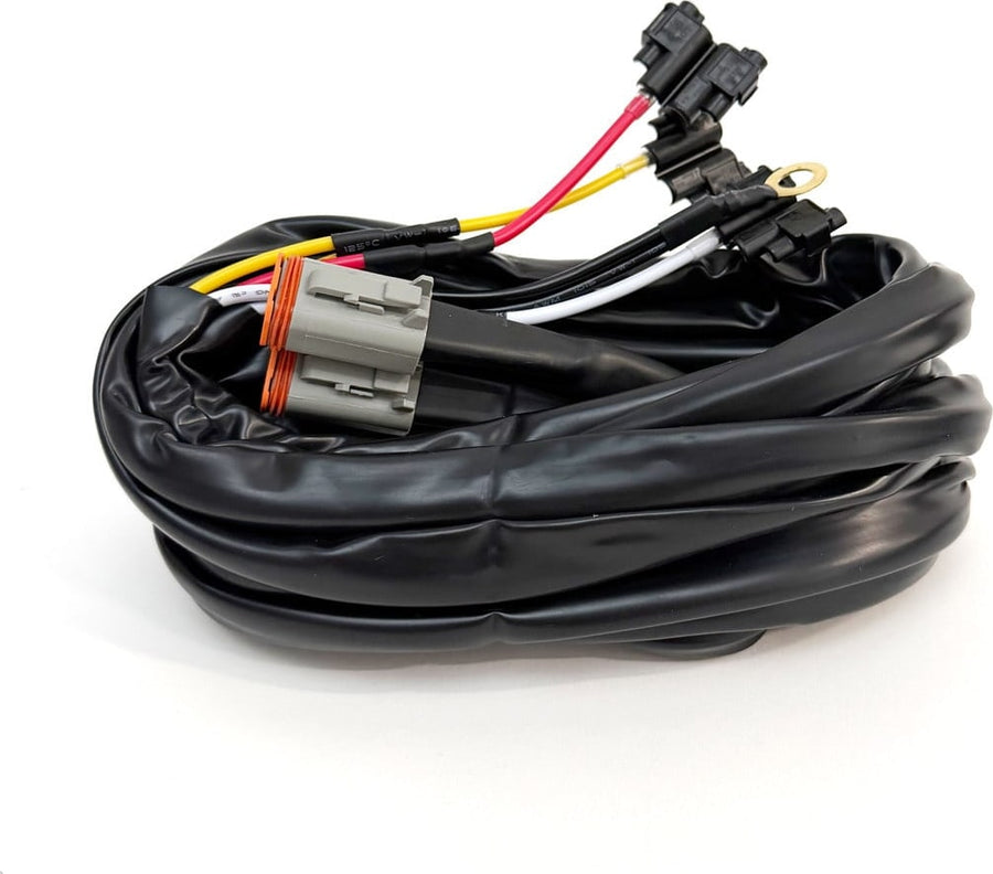 Wiring Harnesses by Baja Designs: A coiled dual lead harness with a gray Deutsch connector, relays and colored leads on white.