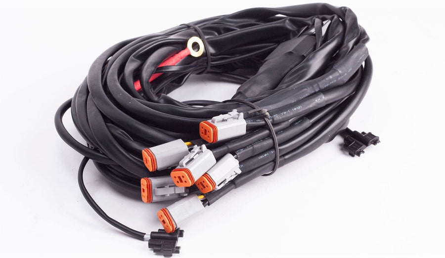 Wiring Harnesses by Baja Designs: A coiled upfitter harness with six gray Deutsch connectors on white.