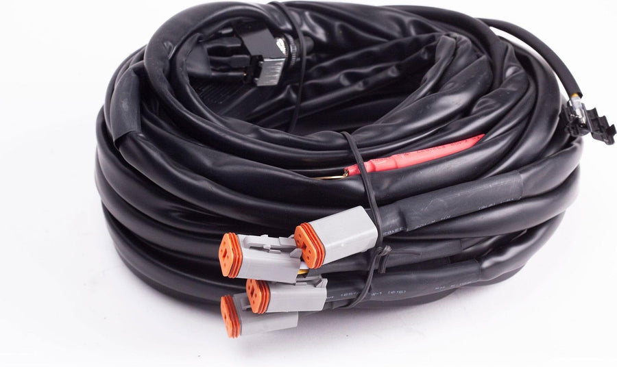 Wiring Harnesses by Baja Designs: A coiled wiring harness with four gray Deutsch connectors on white.
