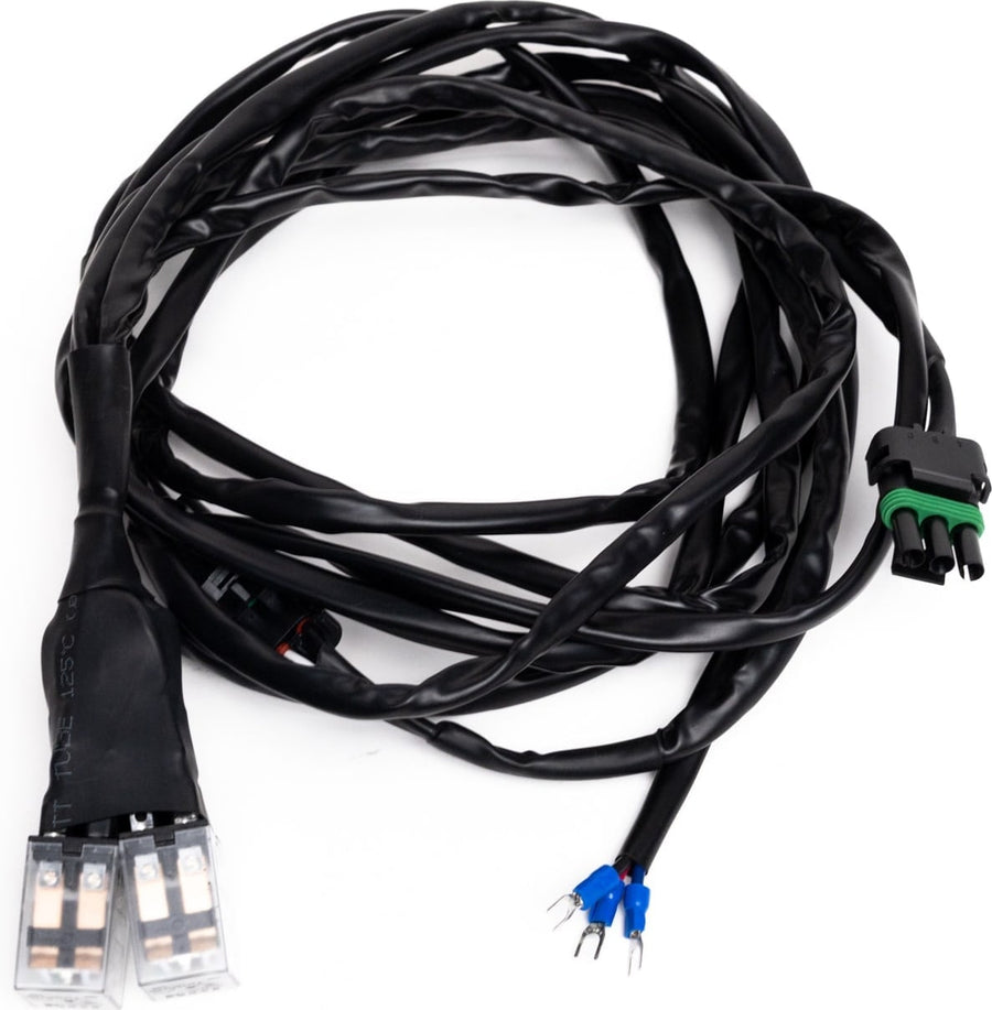 Wiring Harnesses by Baja Designs: A black actuator adaptor harness with clear motor plugs, weatherpack connectors and blue spade leads on white.