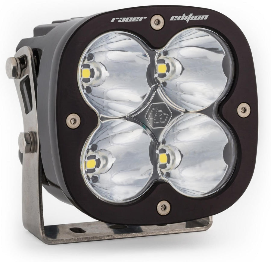 XL Light Pods by Baja Designs: A single black XL Racer Edition LED light pod with a clear spot lens on a stainless mounting bracket, on a white background.