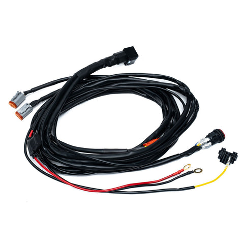 Baja Designs Squadron 2.0 4-Pin Deutsch 2-Light Harness, whole product on a studio background: A two light wiring harness with two gray Deutsch connectors, a round switch and power leads on white