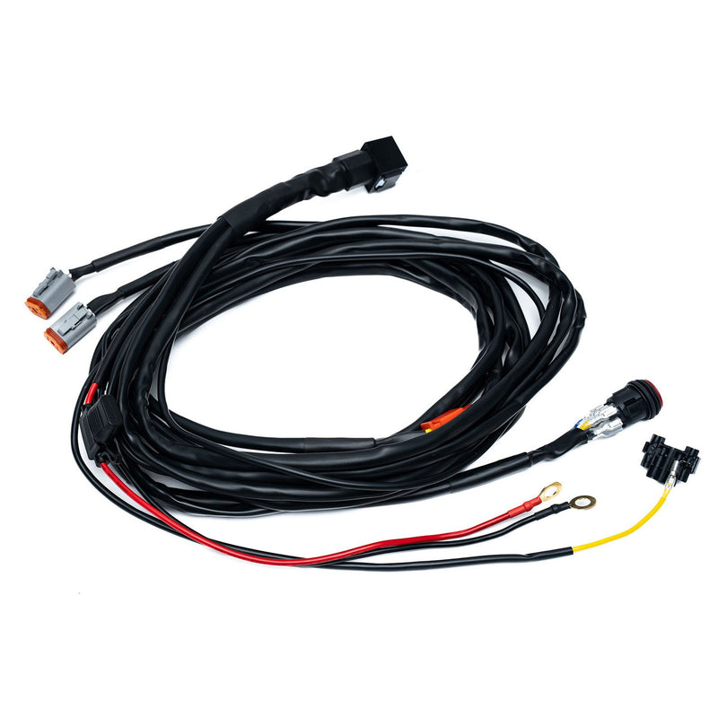 Baja Designs Squadron 2.0 4-Pin Deutsch 2-Light Harness, whole product on a studio background: A two light wiring harness with two gray Deutsch connectors, a round switch and power leads on white