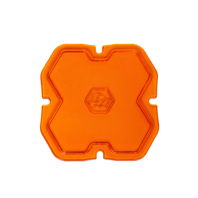 Baja Designs Squadron 2.0 Light Pod Lens Kit, complete kit on a studio background: A orange factory amber Squadron pod lens with a spot optic pattern and a molded Baja Designs logo, shown flat on a white background