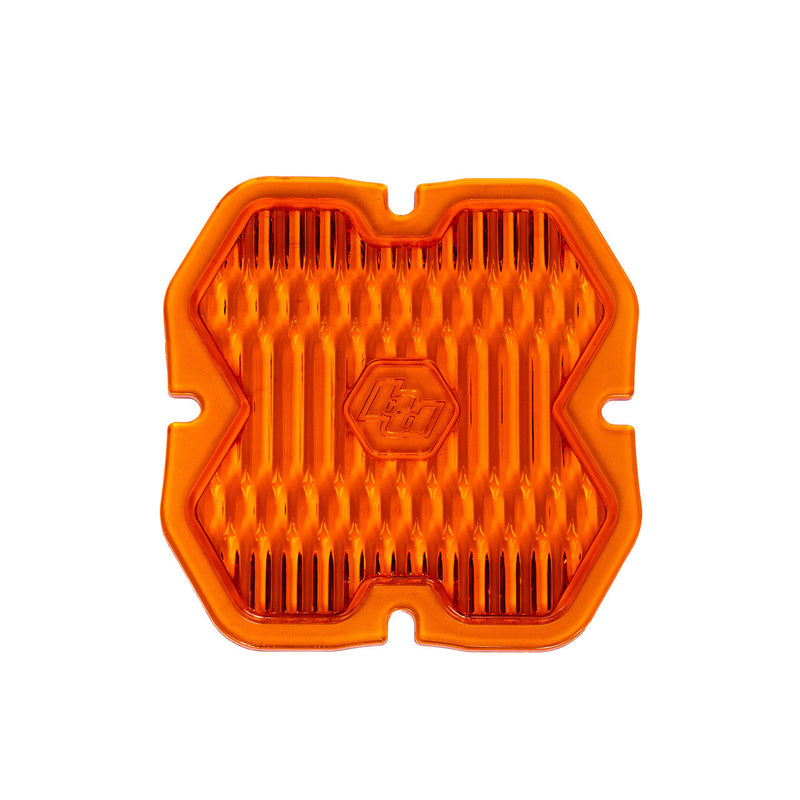 Baja Designs Squadron 2.0 Light Pod Lens Kit, complete kit on a studio background: single amber Squadron snap-on replacement lens with a wide cornering fluted optic pattern on a white background