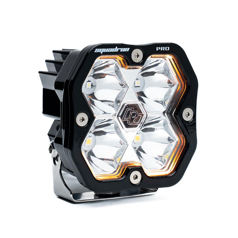 Baja Designs Squadron 2.0 Pro Black LED Auxiliary Light Pod, whole product on a studio background: A black Baja Designs Squadron Pro LED pod with a clear spot lens on a white background