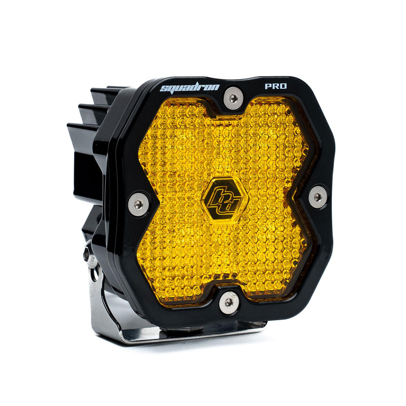 Baja Designs Squadron 2.0 Pro Black LED Auxiliary Light Pod, whole product on a studio background: A black Baja Designs Squadron Pro LED pod with an amber work/scene lens on a white background