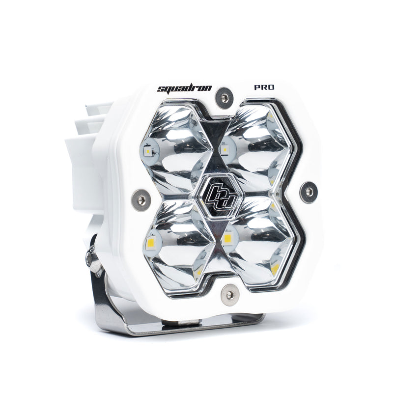 Baja Designs Squadron 2.0 Pro White LED Auxiliary Light Pod, whole product on a studio background: A white Baja Designs Squadron Pro LED pod with a clear spot lens on a white background