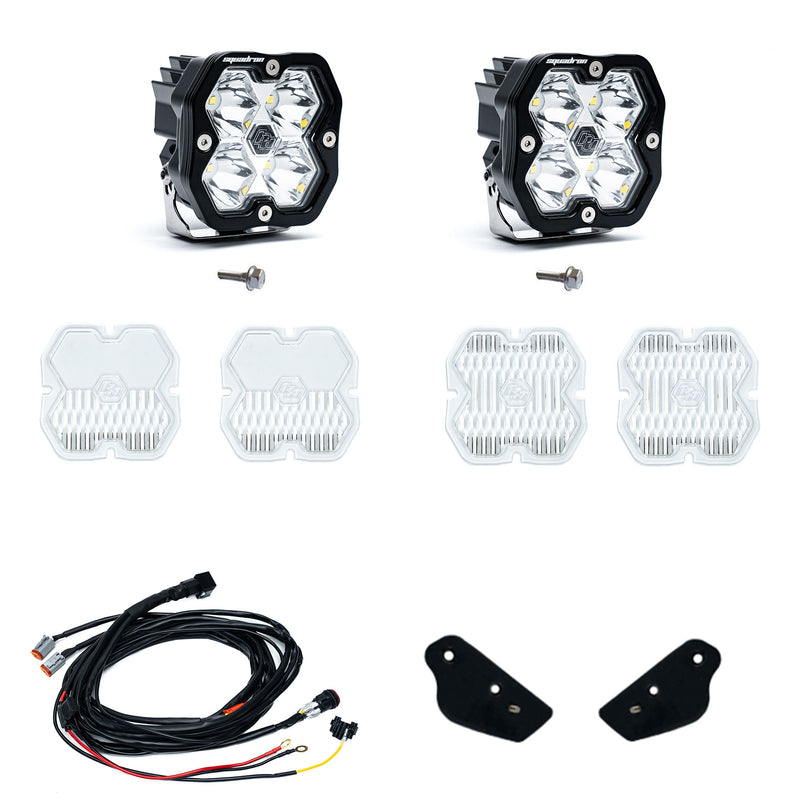 Baja Designs Squadron 2.0 Sport A-Pillar Light Kit, complete kit on a studio background: two Squadron Pro pods, mounting bolts, spare clear lens covers, a wiring harness
