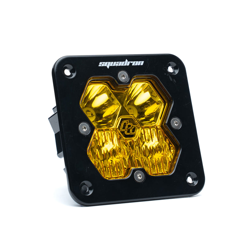 Baja Designs Squadron 2.0 Sport Black Flush Mount LED Auxiliary Light Pod, whole product on a studio background: single black flush mount Squadron Sport pod with amber driving combo lens on white. Amber lens while the SKU code reads as a clear-lens