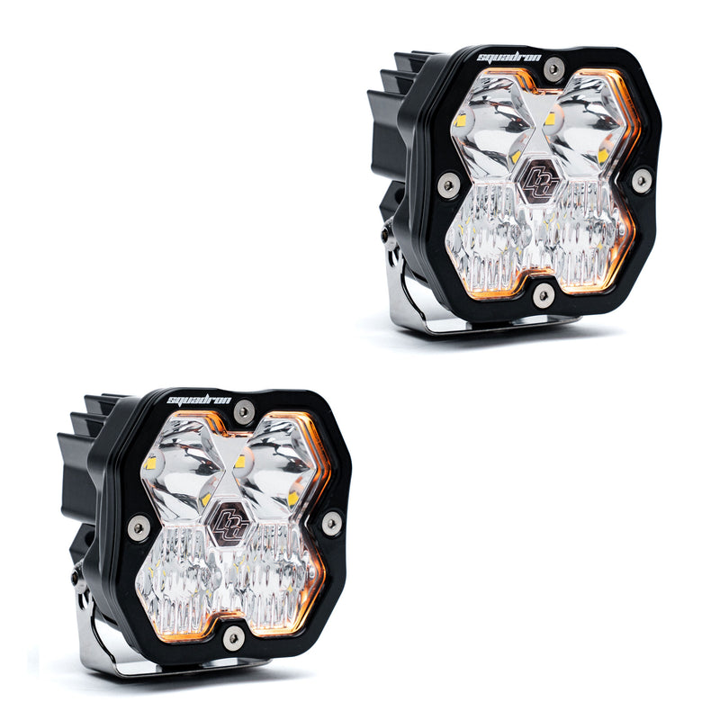 Baja Designs Squadron 2.0 Sport Black LED Auxiliary Light Pod Pair, whole product on a studio background: A pair of black Squadron LED pods with clear combo lenses on a white background