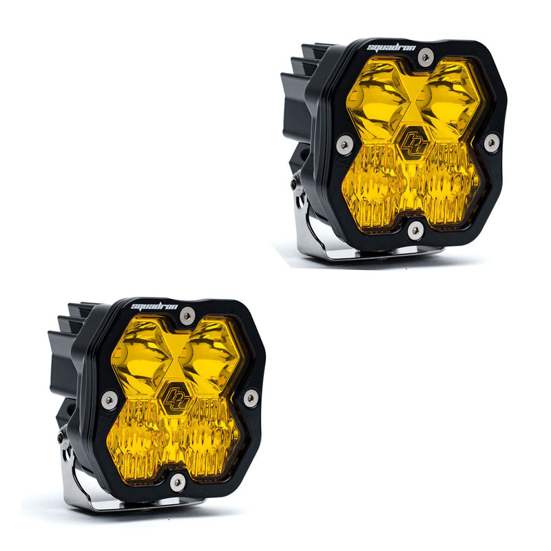 Baja Designs Squadron 2.0 Sport Black LED Auxiliary Light Pod Pair, whole product on a studio background: A pair of black Squadron LED pods with amber lenses on a white background