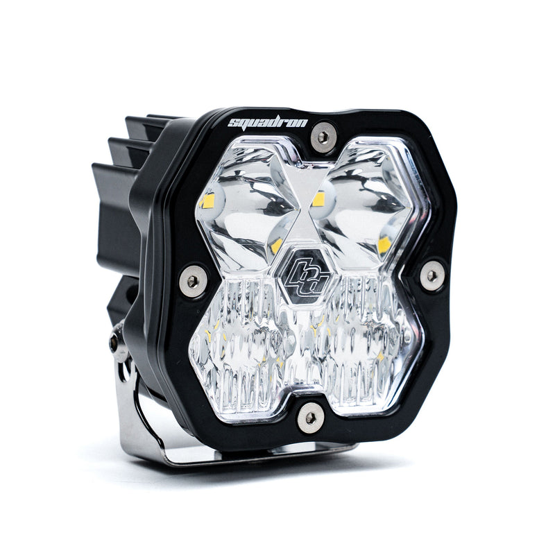 Baja Designs Squadron 2.0 Sport Black LED Auxiliary Light Pod, whole product on a studio background: single black Squadron Sport pod with clear driving combo lens on its bracket, on white