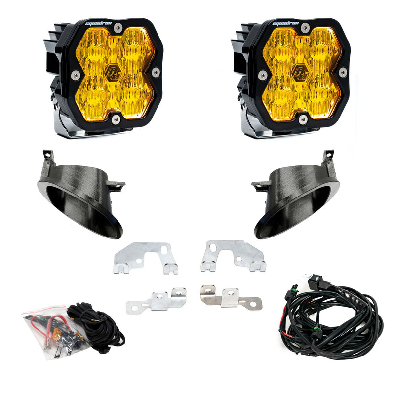 Baja Designs Squadron 2.0 Sport Fog Pocket Light Kit, complete kit on a studio background: fog pocket kit with two square amber lens pods, two black bezel cups, steel brackets, hardware and a harness on white