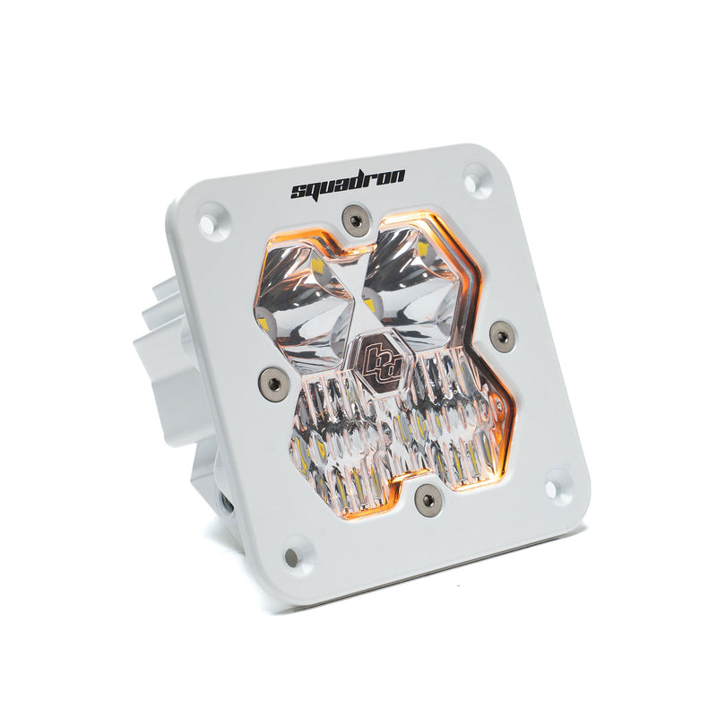 Baja Designs Squadron 2.0 Sport White Flush Mount LED Auxiliary Light Pod, whole product on a studio background: single white flush mount Squadron Sport pod with clear driving combo lens and amber backlight glow on white