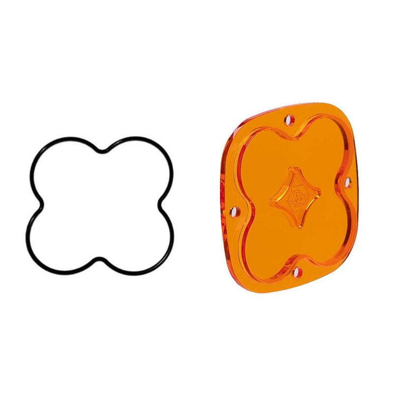 Baja Designs Squadron Light Pod Lens Kit, complete kit on a studio background: A orange-amber rounded-square Squadron replacement lens with a smooth spot optic lies beside its black O-ring gasket on a white background