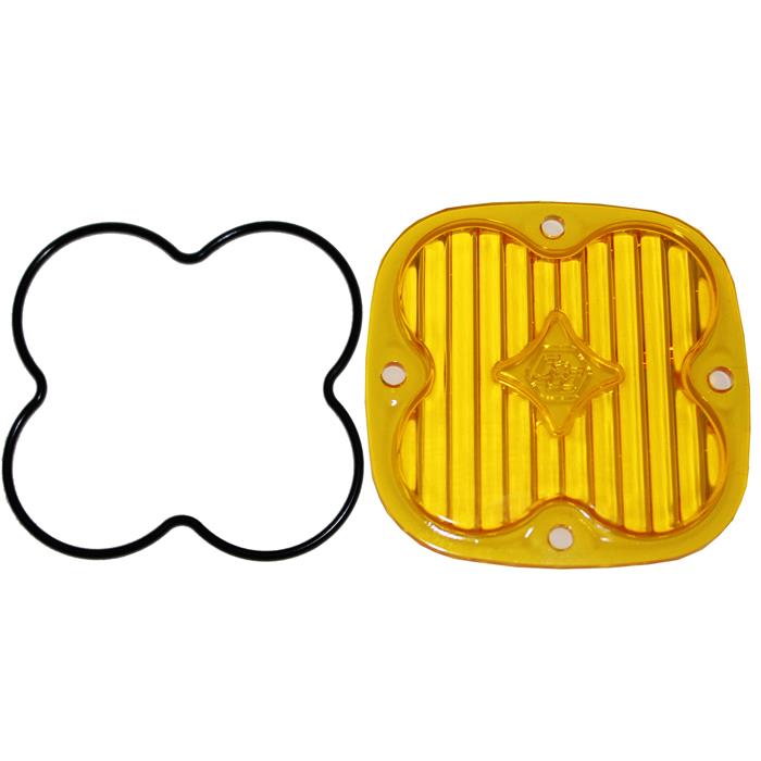 Baja Designs Squadron Light Pod Lens Kit, complete kit on a studio background: A yellow-amber rounded-square Squadron replacement lens with a fully fluted wide cornering optic lies beside its black O-ring gasket on a white background