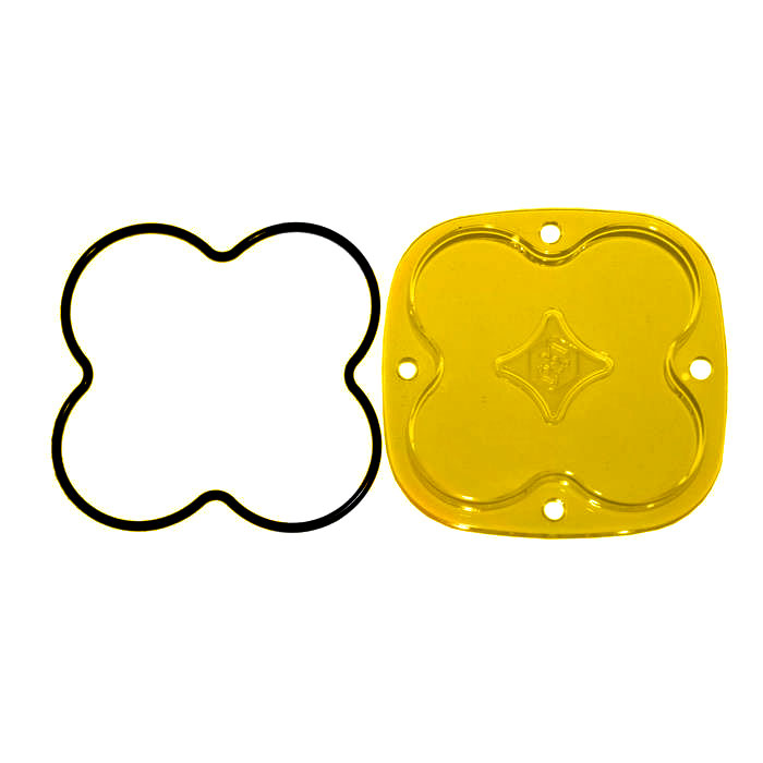 Baja Designs Squadron Light Pod Lens Kit, complete kit on a studio background: A yellow-amber rounded-square Squadron replacement lens with a smooth spot optic lies beside its black O-ring gasket on a white background
