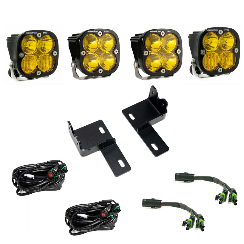 Baja Designs Squadron Pro Behind-the-Grille Kit, complete kit on a studio background: four amber-lens Squadron Pro LED pods with two grille brackets, two switched harnesses and two splitter harnesses on white