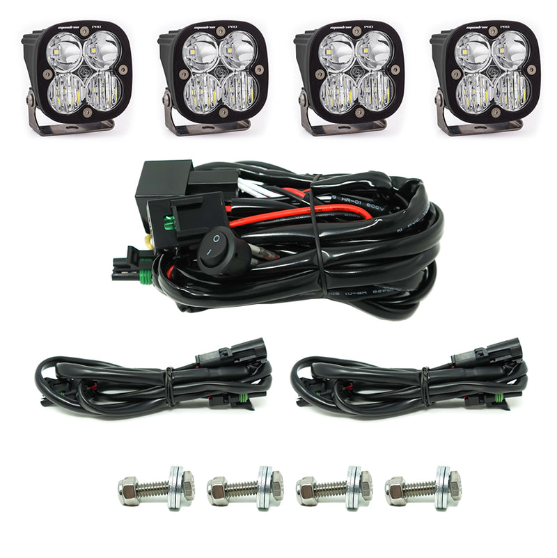 Baja Designs Squadron Pro Grille Light Kit, complete kit on a studio background: four Squadron Pro pods with clear lenses, a switch harness, two extension harnesses and four mounting bolts on white