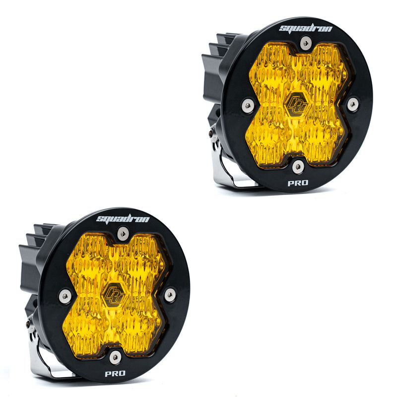 Baja Designs Squadron-R 2.0 Pro Black LED Auxiliary Light Pod Pair, whole product on a studio background: A pair of round black Squadron-R Pro LED pods with amber lenses on a white background