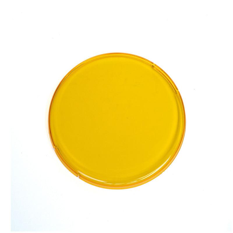 Baja Designs Squadron-R 2.0 Single Rock Guard, whole product on a studio background: an amber round snap-on rock guard cover on white