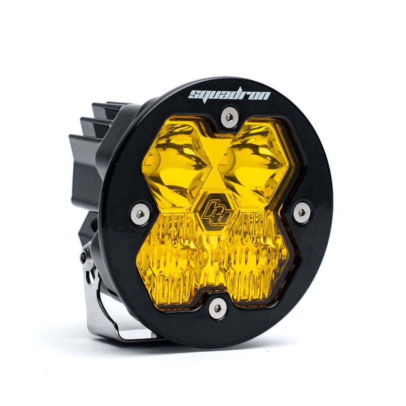 Baja Designs Squadron-R 2.0 Sport Black LED Auxiliary Light Pod, whole product on a studio background: A round black Squadron-R LED pod with an amber lens on a white background