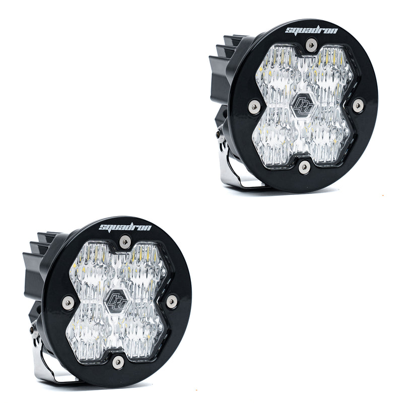 Baja Designs Squadron-R 2.0 Sport Black LED Auxiliary Light Pod Pair, whole product on a studio background: A pair of round black Squadron-R LED pods with clear fluted lenses on a white background