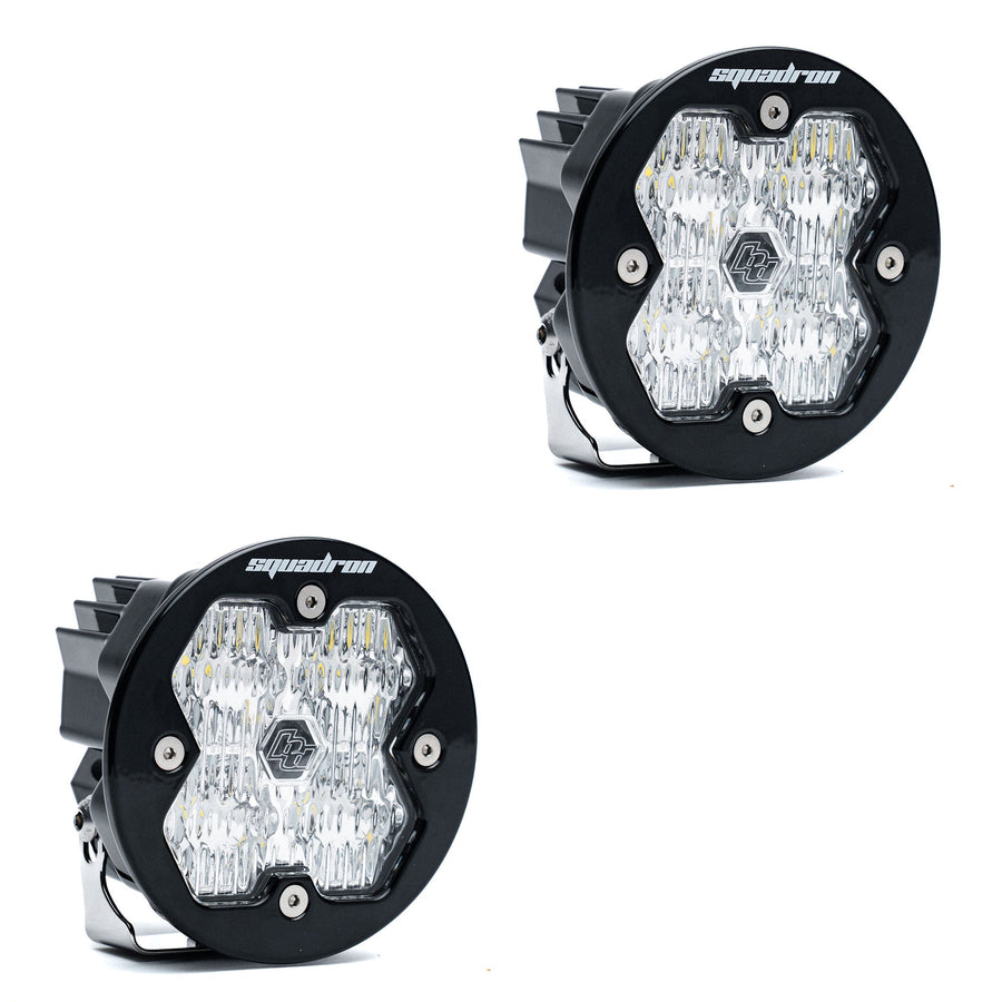 Squadron Light Pods by Baja Designs: A pair of round black Squadron-R LED pods with clear fluted lenses on a white background