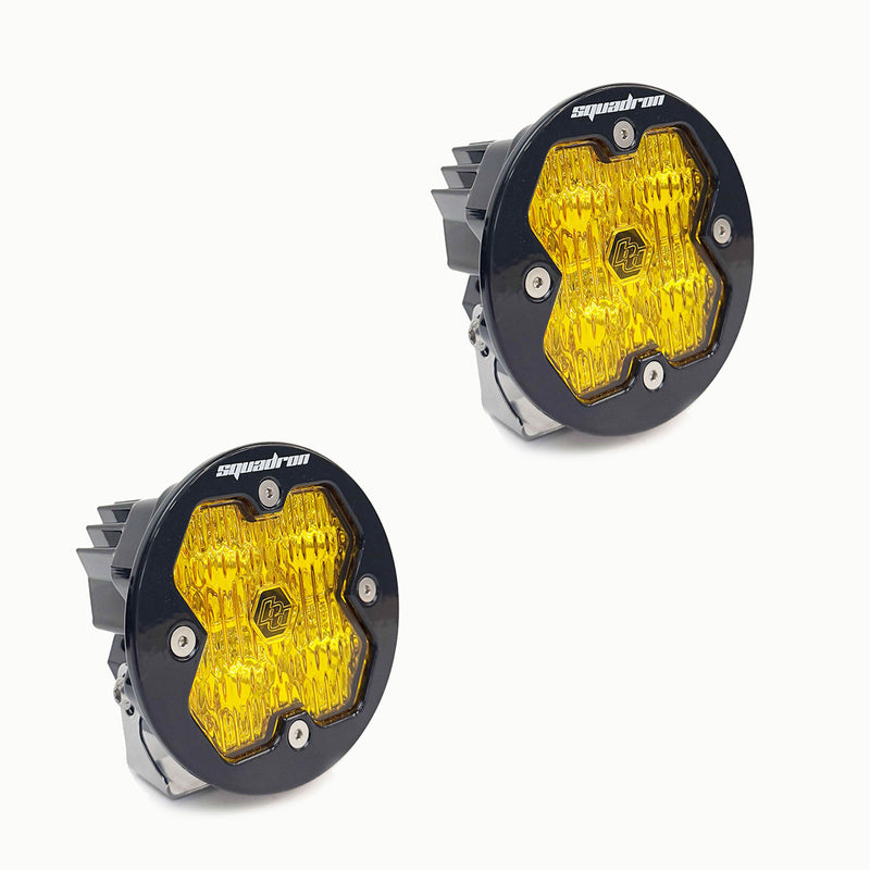 Baja Designs Squadron-R 2.0 Sport Black LED Auxiliary Light Pod Pair, whole product on a studio background: A pair of round black Squadron-R LED pods with amber lenses on an off-white background
