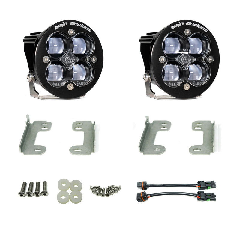 Baja Designs Squadron-R SAE Fog Pocket Light Kit, complete kit on a studio background: two round Squadron-R SAE pods with clear lenses, zinc mounting brackets, hardware and two adapter harnesses on a white background