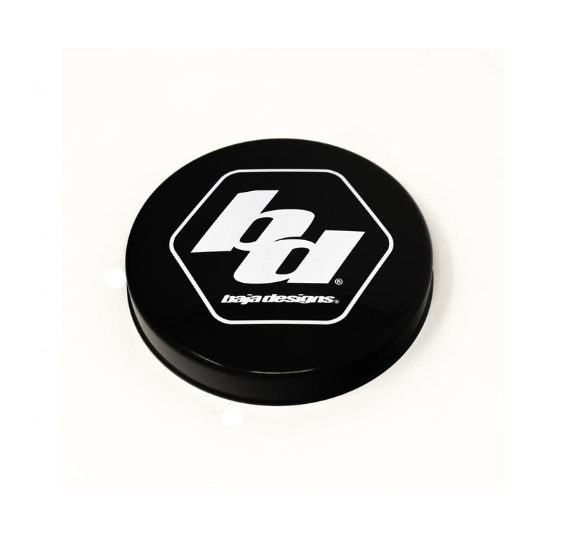 Baja Designs Squadron-R Single Rock Guard, whole product on a studio background: A black round rock guard cover with a white Baja Designs hex logo on a white background. Title gives no lens color and this SKU shows several colors, so the color