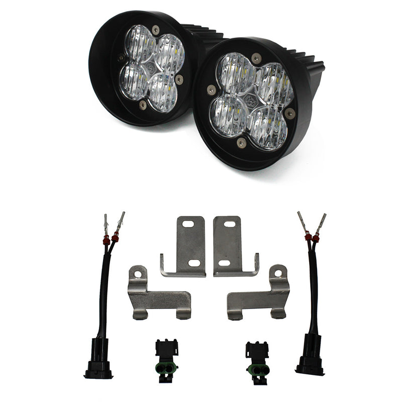 Baja Designs Squadron-R Sport Fog Pocket Light Kit, complete kit on a studio background: two round black Squadron-R fog pods with clear lenses, four stainless brackets, two pigtail harnesses and two connectors on white